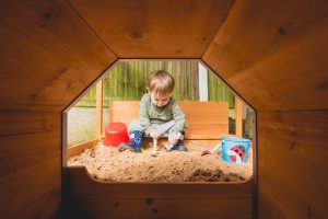 product review - choo choo train sandpit - boy through a tunnel