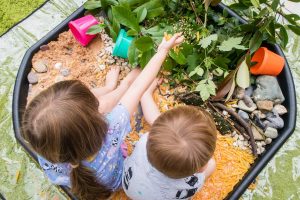 Tuff Tray Ideas - Dino World - in use