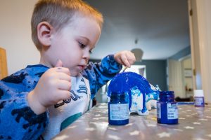 Dinosaur Crafts - painting our dinosaur money banks