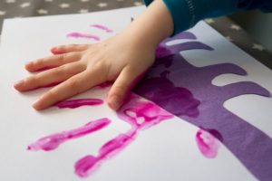 Dinosaur Crafts - making our dinosaur handprints