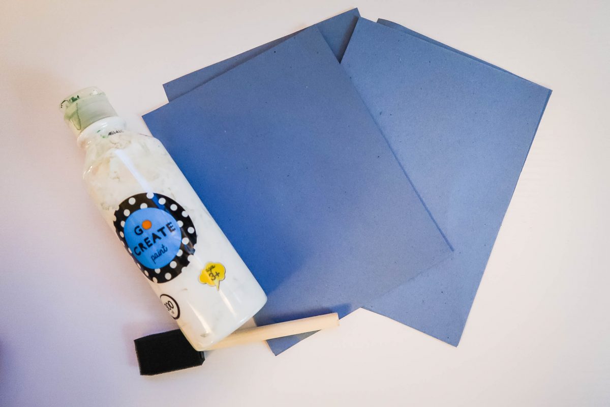 What you need for your snowman cards - step one: blue craft paper | white poster paint | paint brust | little feet  